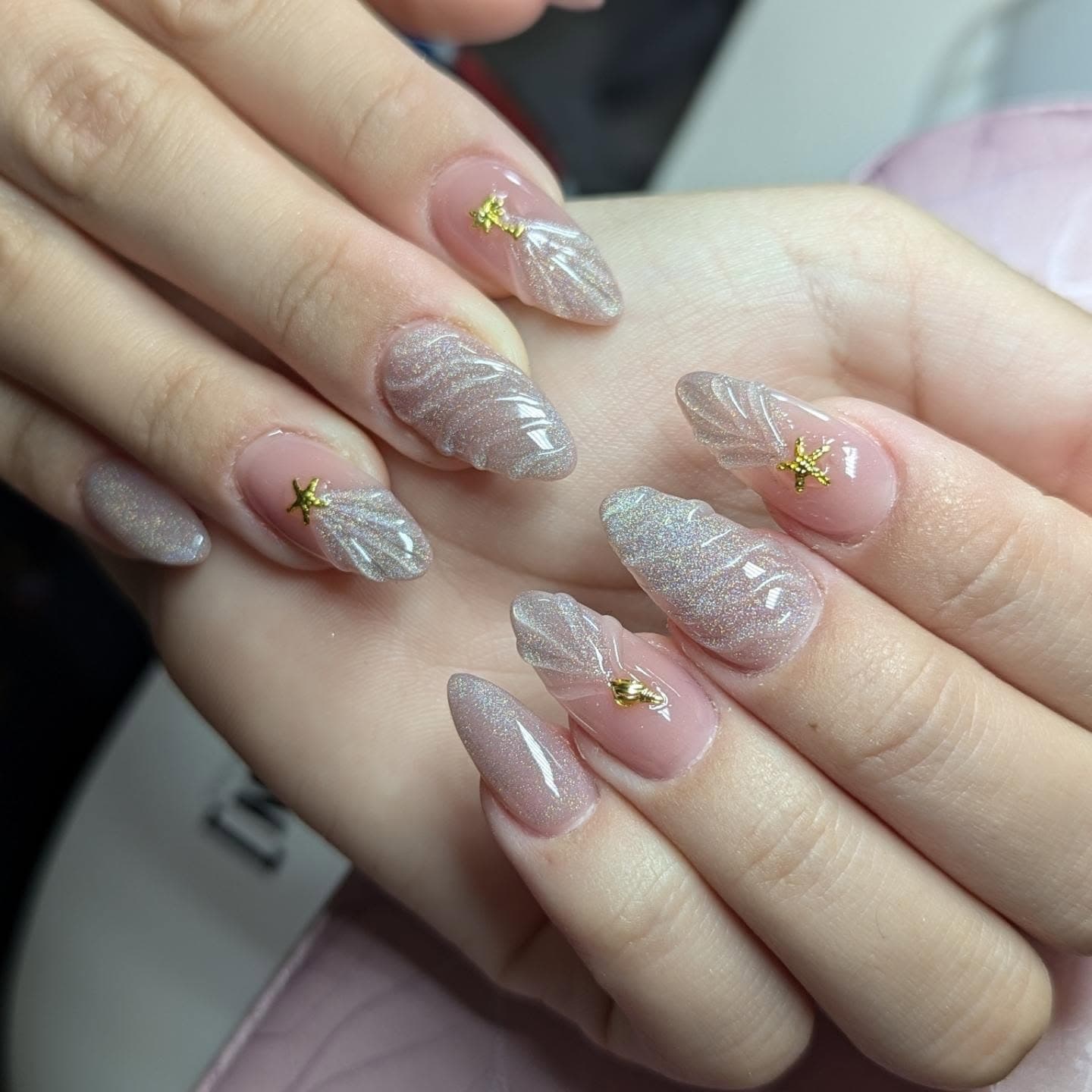 Soft pink shell-inspired manicure